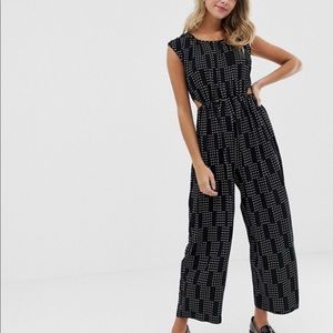 Dotted jumpsuit with side cutouts & slit open back